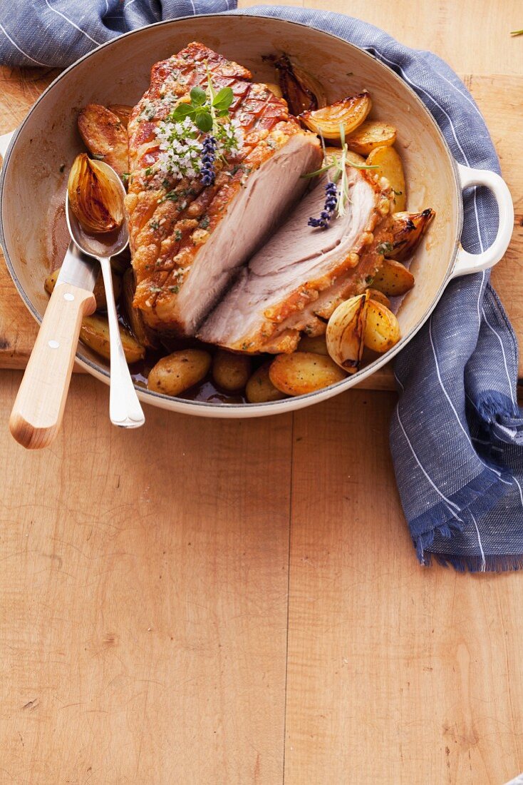 Roast pork with potatoes and onions