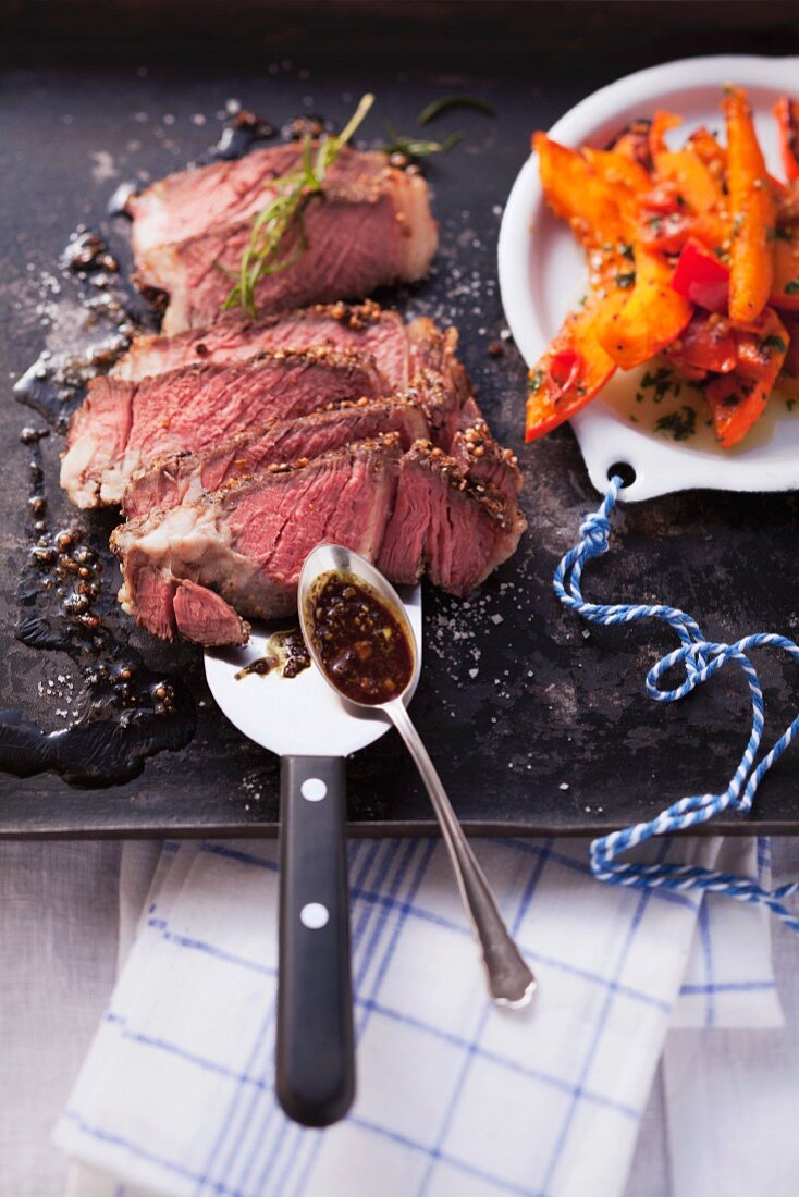 Fried rib-eye steak with pumpkin wedges