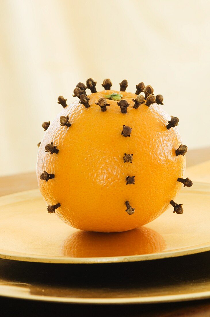An orange pierced with cloves