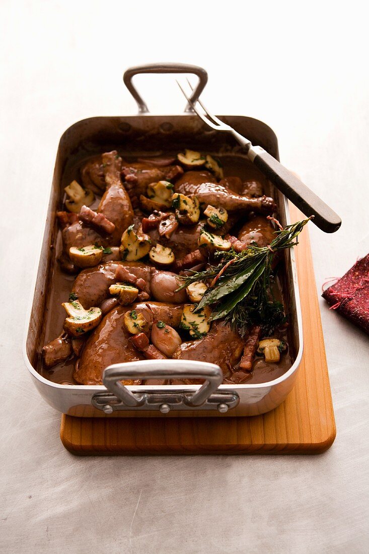 Coq au vin in casserole dish