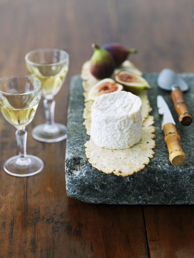 Goat Cheese with Figs on Stone and White Wine
