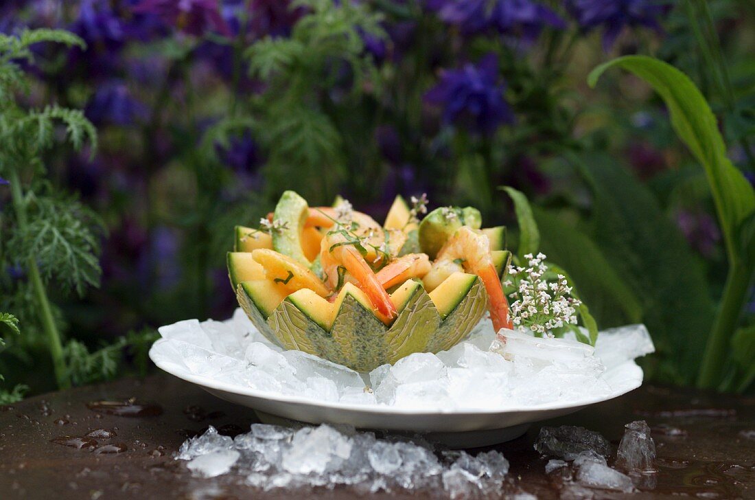Avocado and prawn salad in hollowed-out musk melon