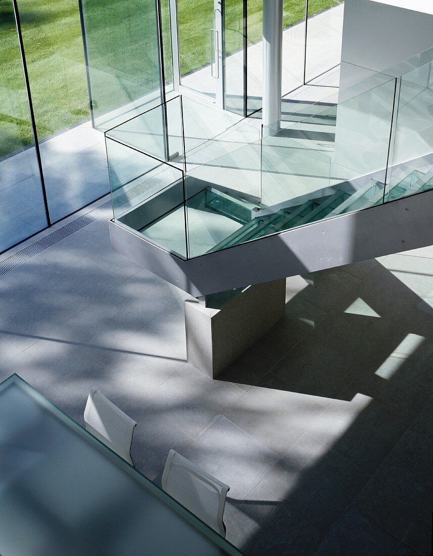 Staircase with glass balustrade in living space