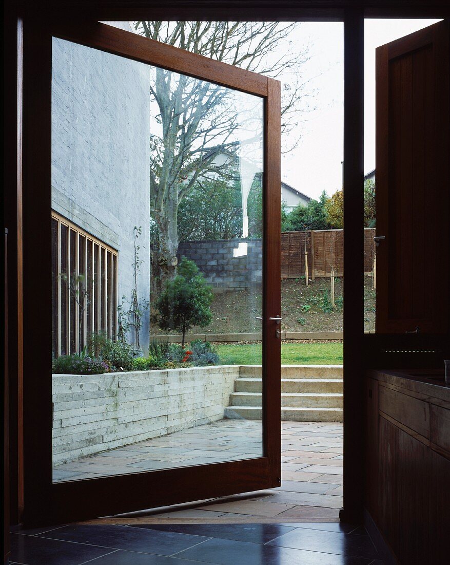Large glass door leading from kitchen to terrace