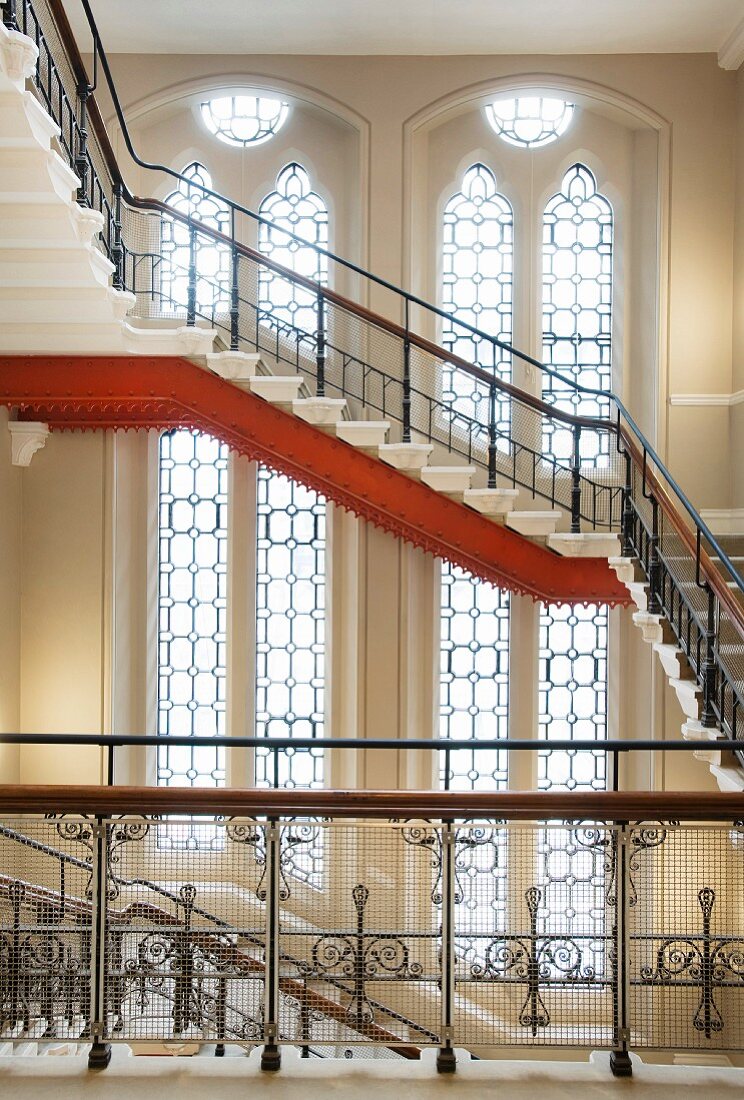 Impressive stairwell with neo-Gothic windows