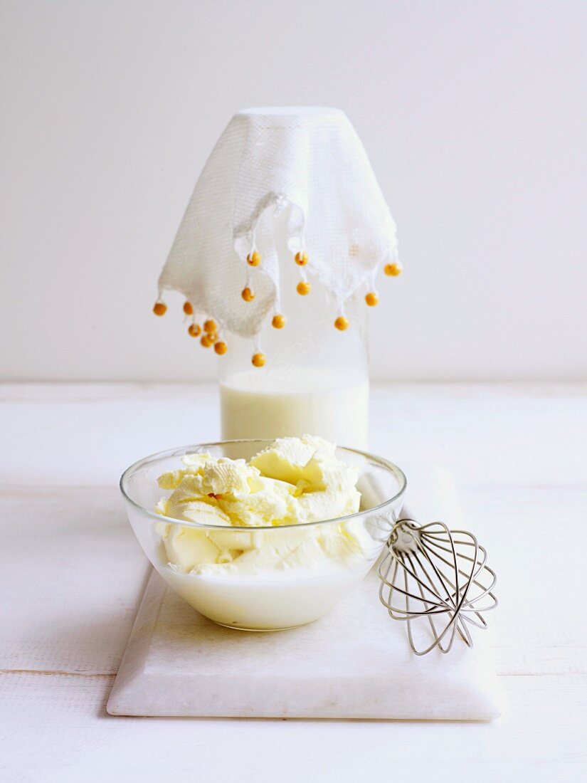 Mascarpone being mixed with milk