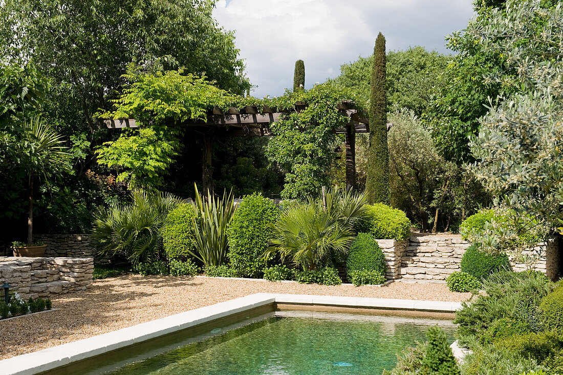 Garden with natural stone walls and swimming pond