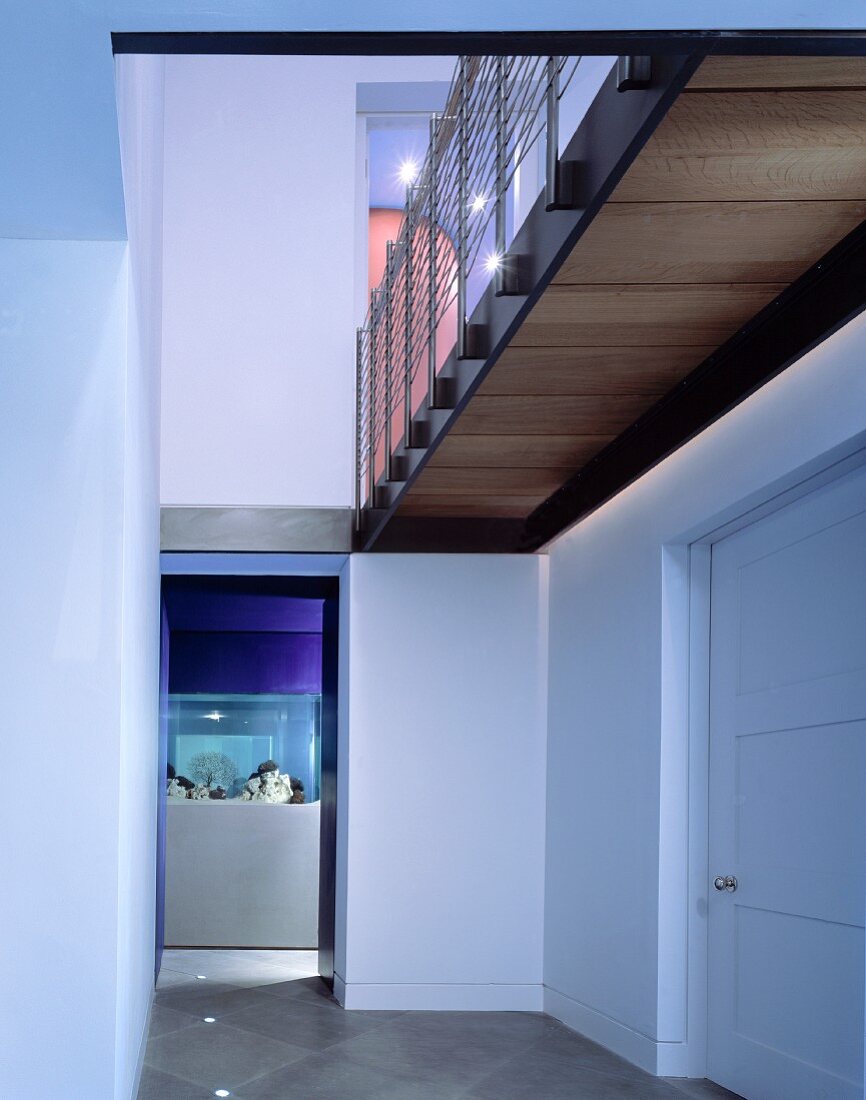 View of aquarium at entrance to bathroom with gallery above