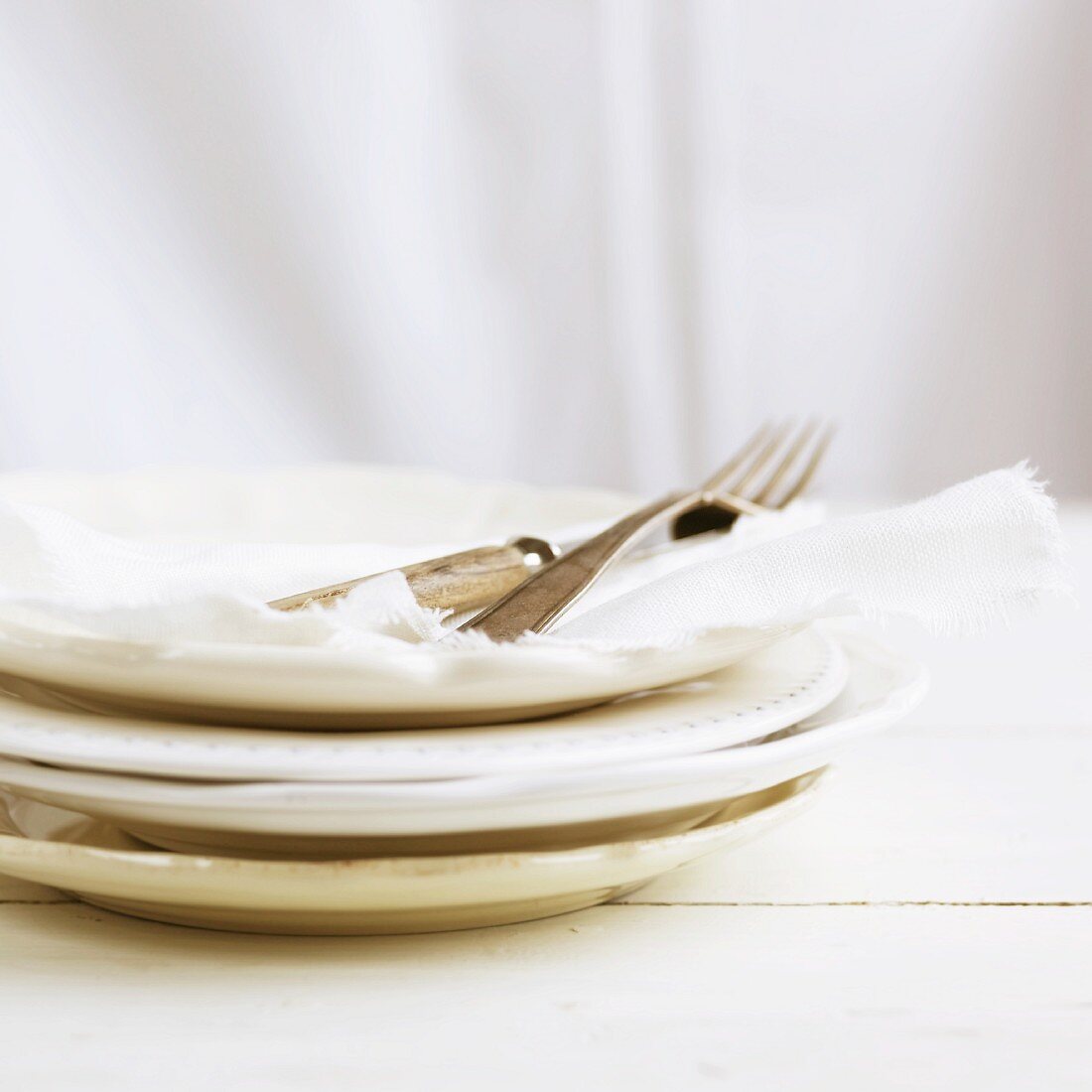 White plates, napkins and cutlery