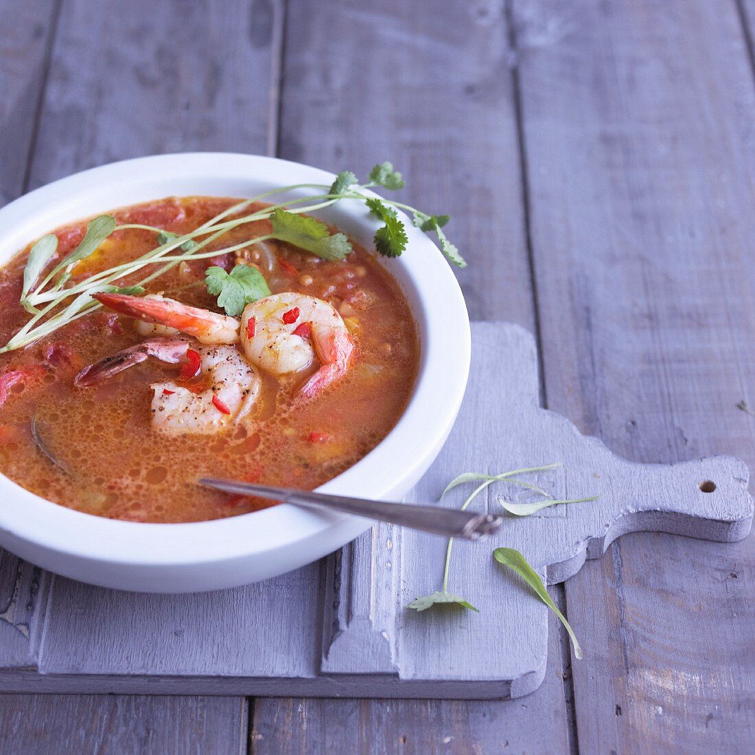Spicy lentil soup with prawns and coriander