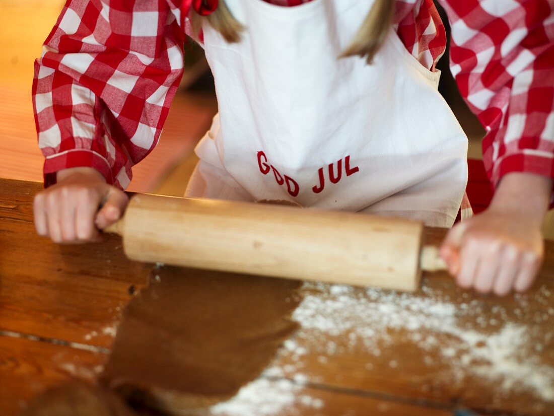 Girl rolling out pastry