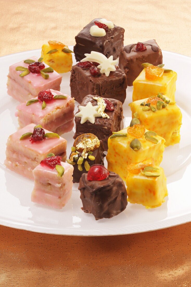 Various petit fours with maple syrup and cranberries