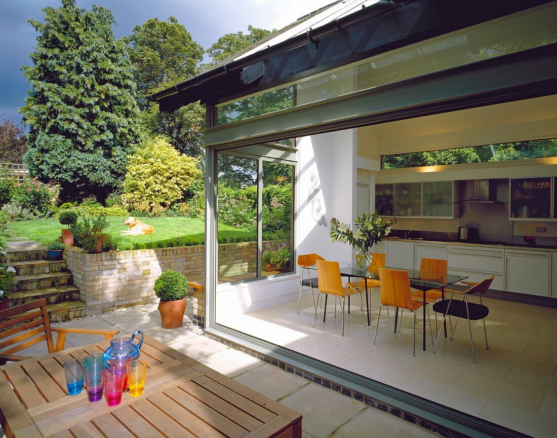 View of kitchen with glass wall from terrace