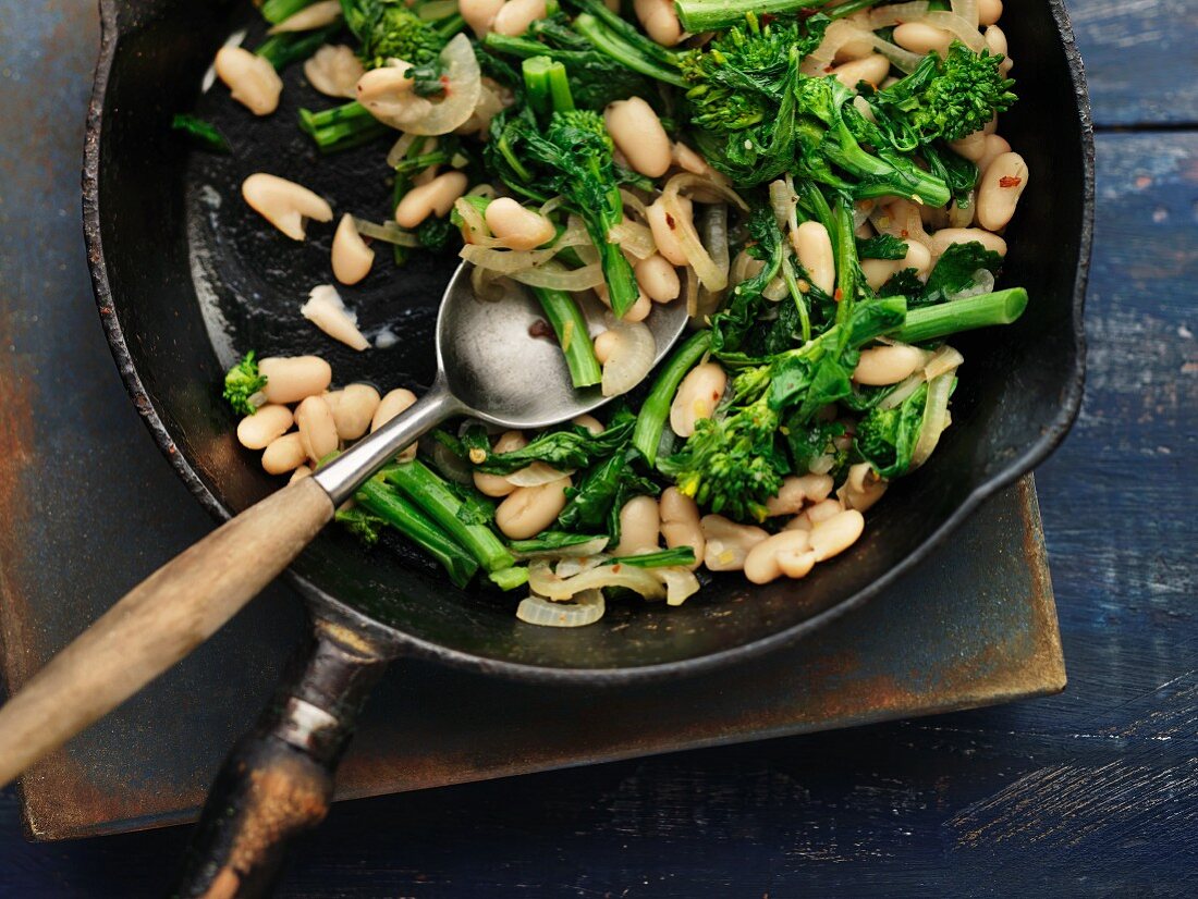 A vegetable stir-fry with beans and rapini cabbage
