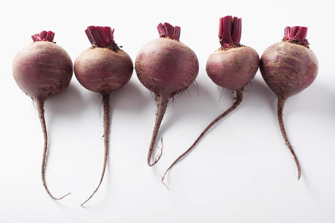 A row of five beetroots
