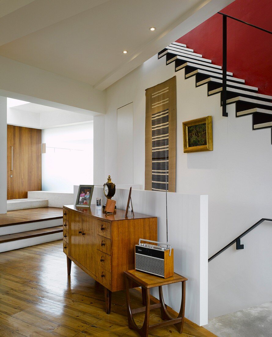 Retro-style cabinet in front of staircase