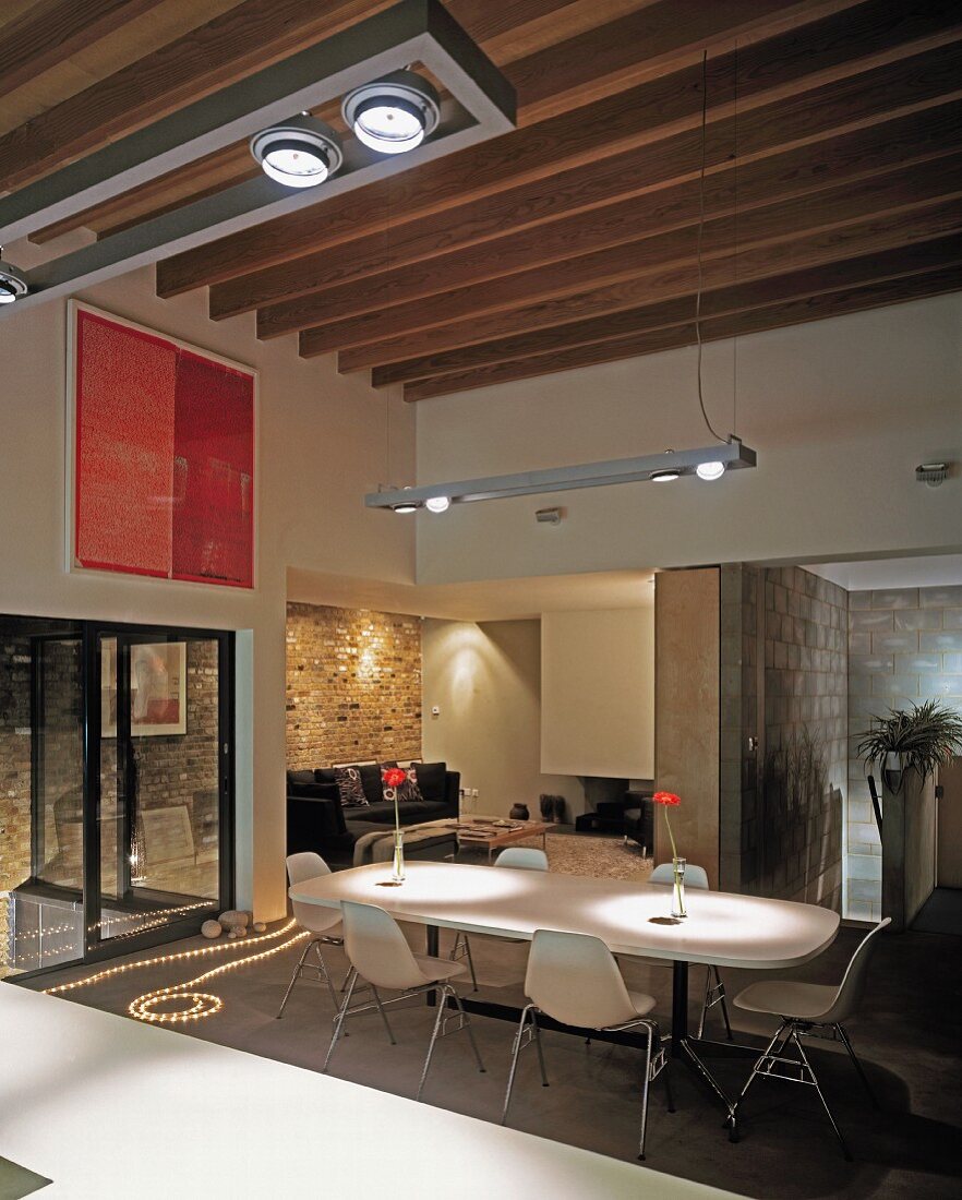 Open-plan living space with view of living-dining area from kitchen