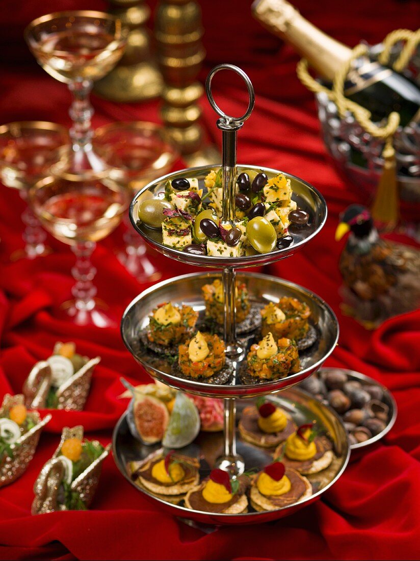 Various canapes on a cake stand