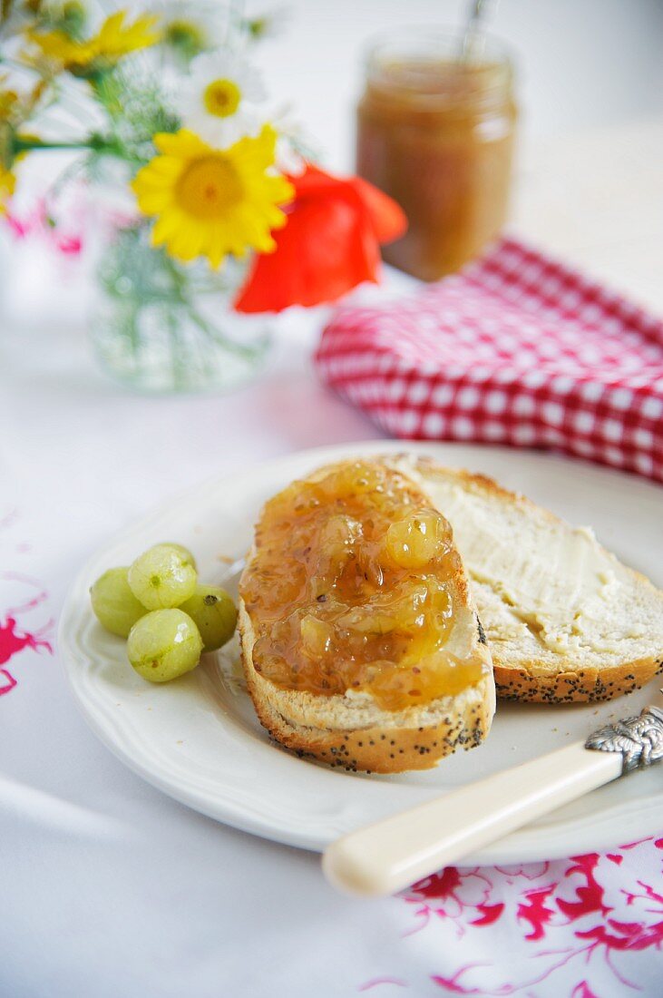 A slice of bread topped with gooseberry jam