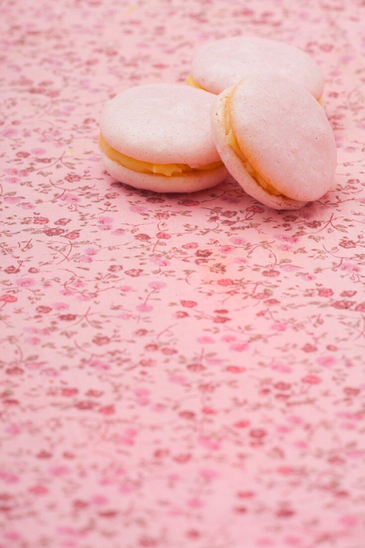 Three pink macarons