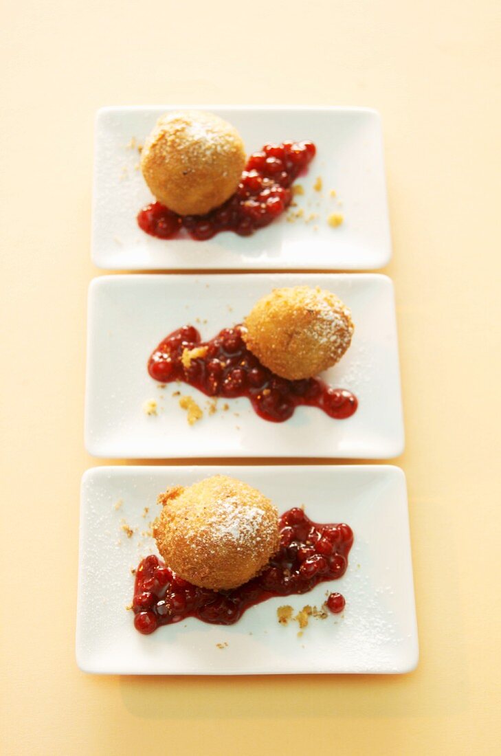 Apple and cinnamon dumplings with cranberry sauce