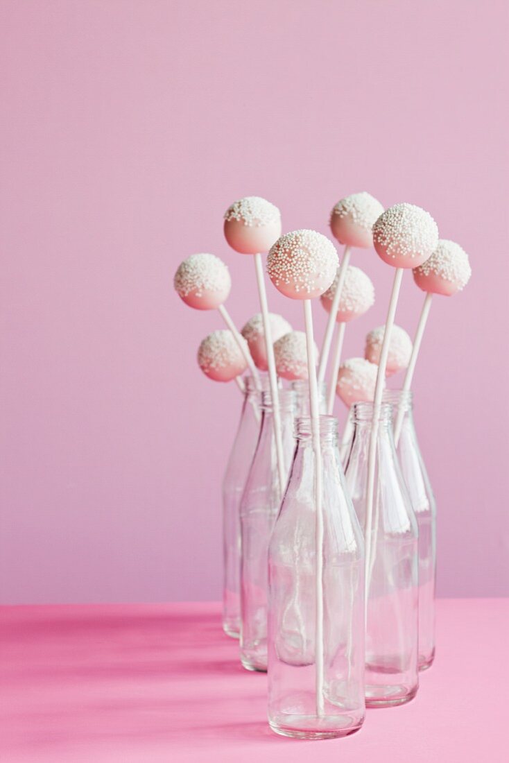 Pink and White Cake Pops in Glass Bottles