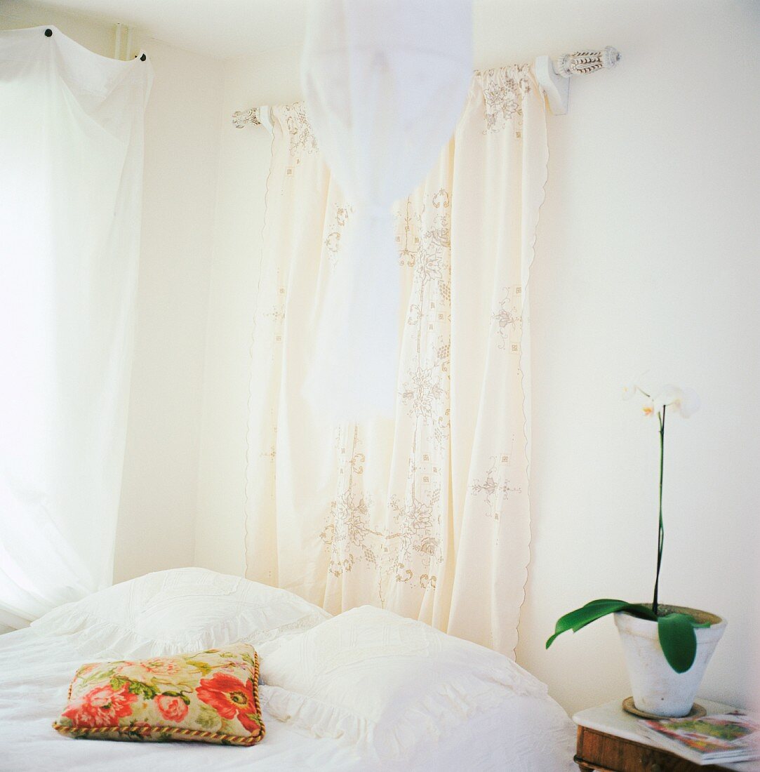 Bedroom with white and cream textiles