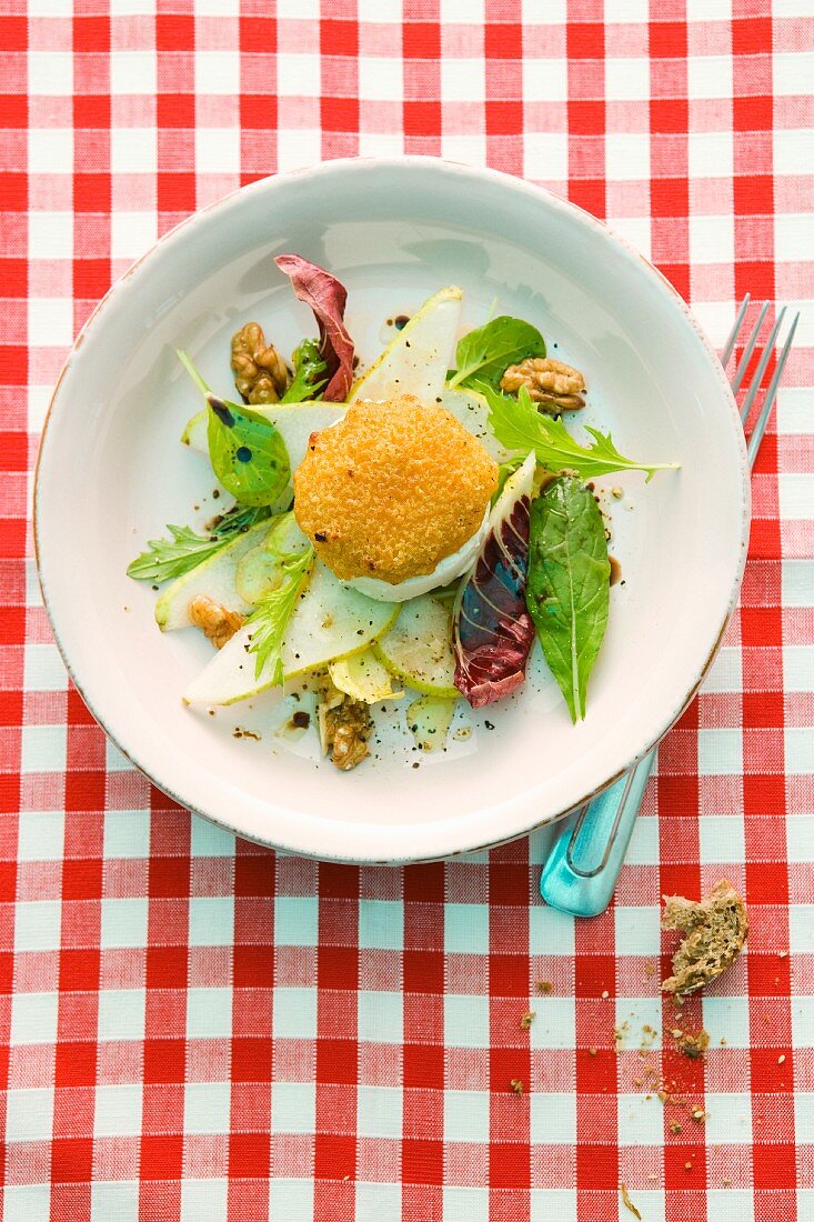 Baked Camembert on a bed of salad with pears