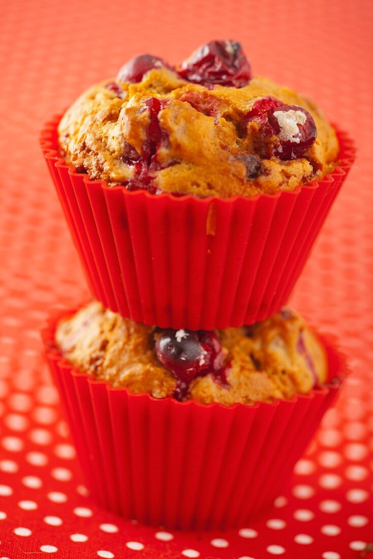 Two cranberry muffins one on top of each other