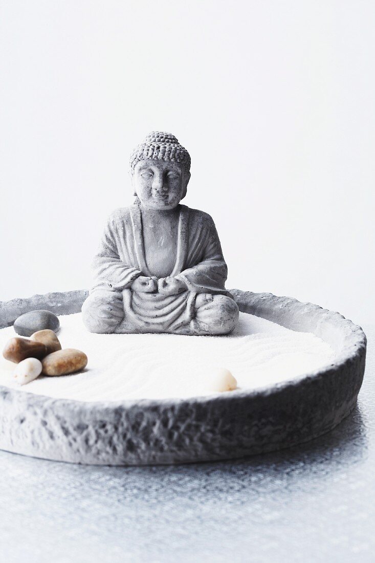 Buddha statue in Zen bowl garden