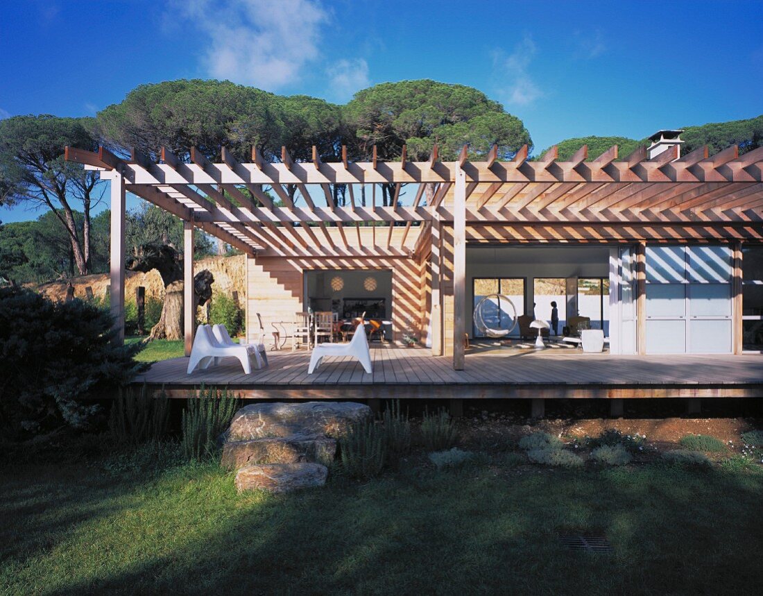 Large wooden terrace with sunshade