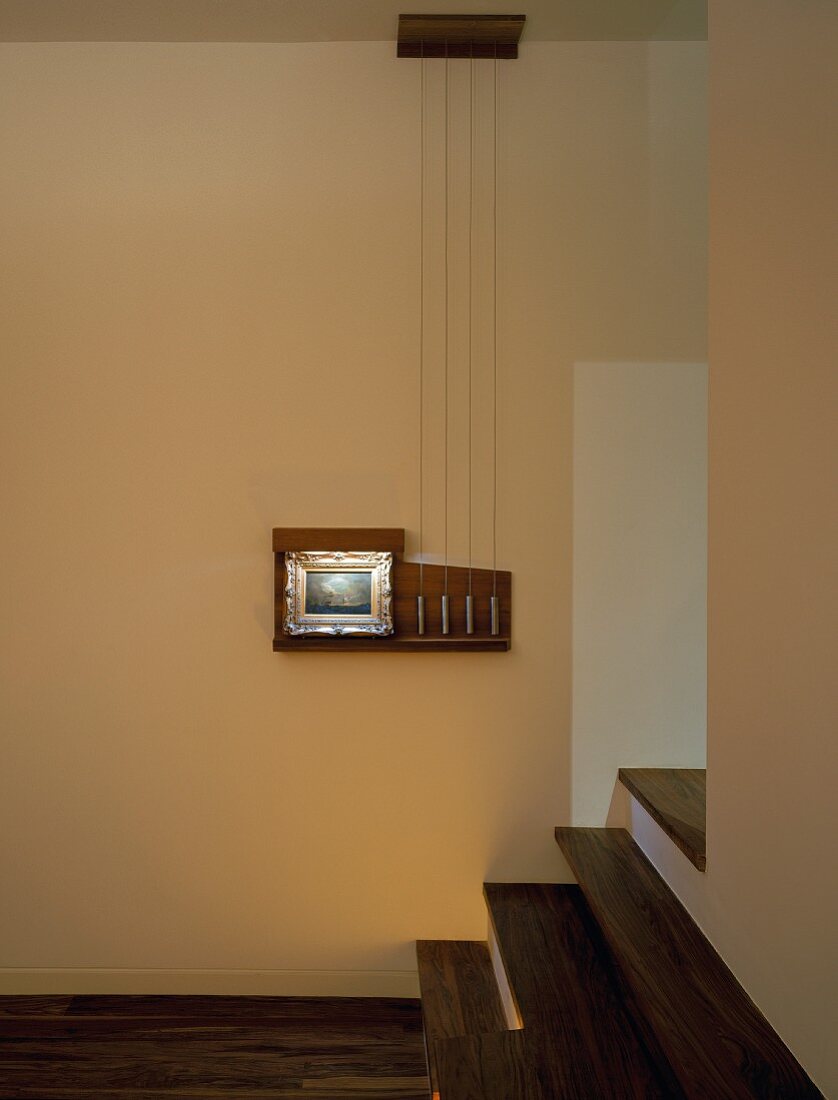 Corner of room with steps leading to floor-to-ceiling doorway