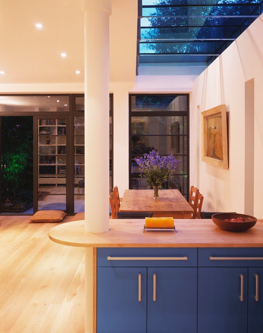 Kitchen counter with dining table in background