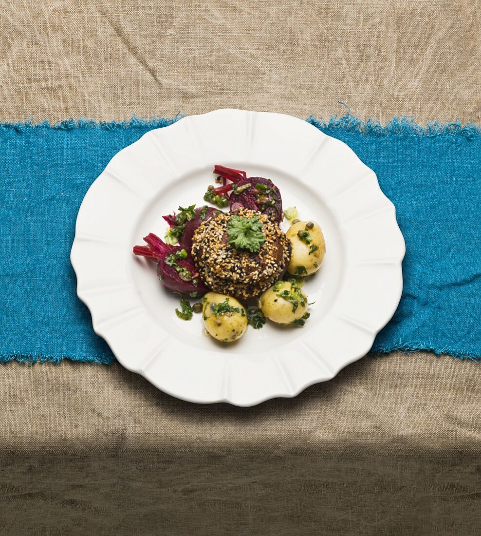 Portobello mushroom in a sesame crust, potatoes and beetroot