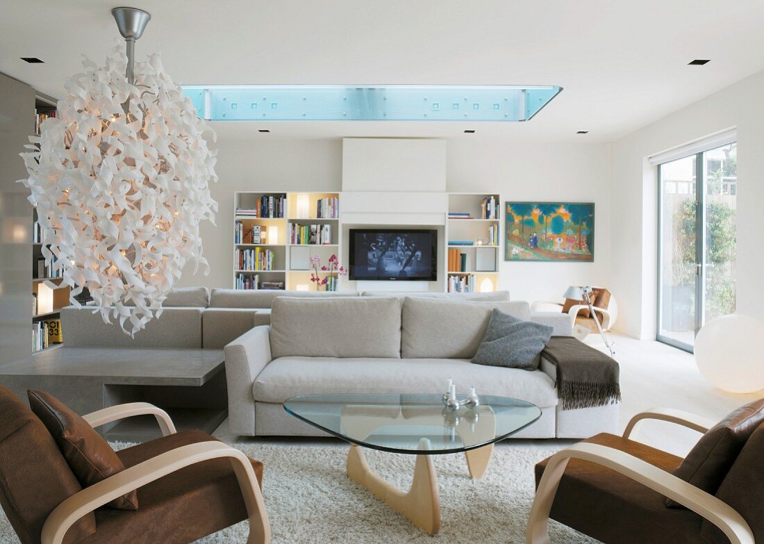 Bright living room with designer lamp and skylight