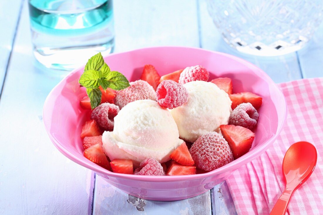 Frozen berries with ice cream