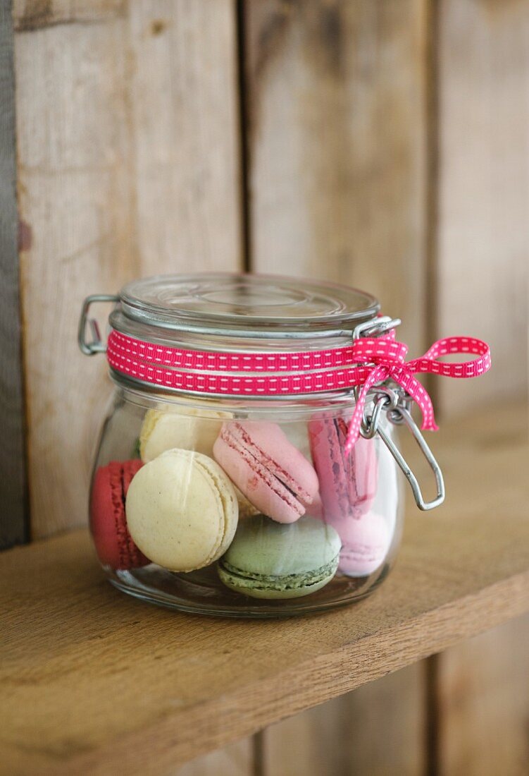 Colourful macaroons in preserving jar as a gift