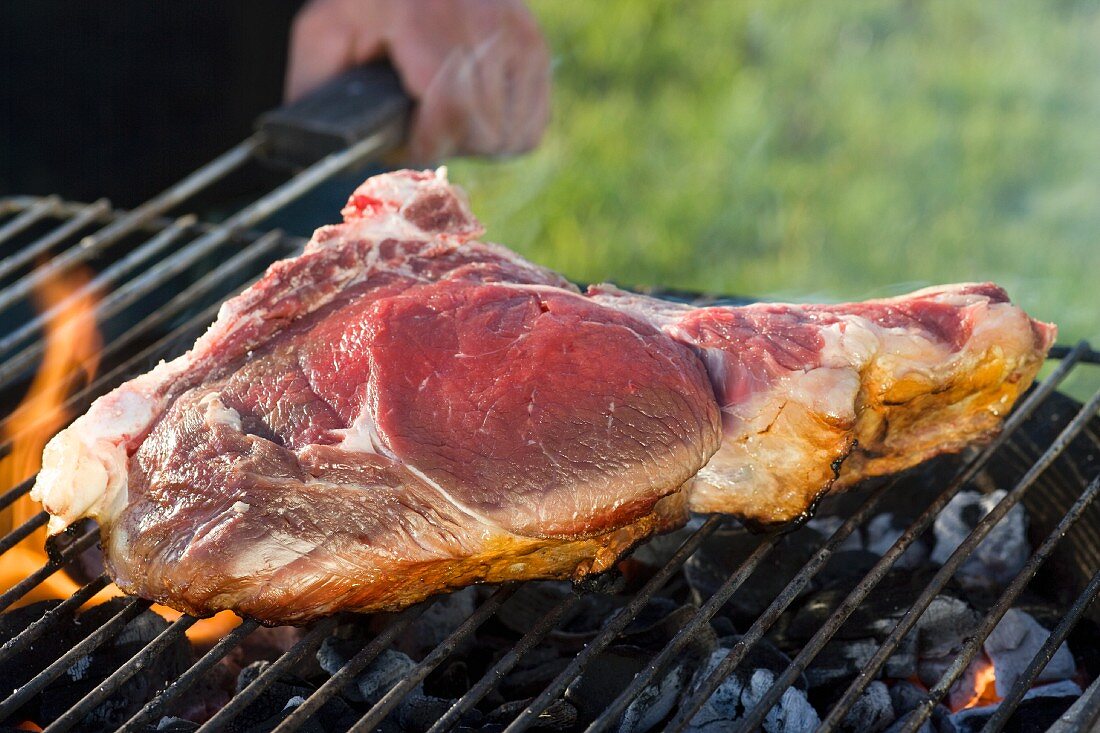 Fore rib of beef on a barbecue