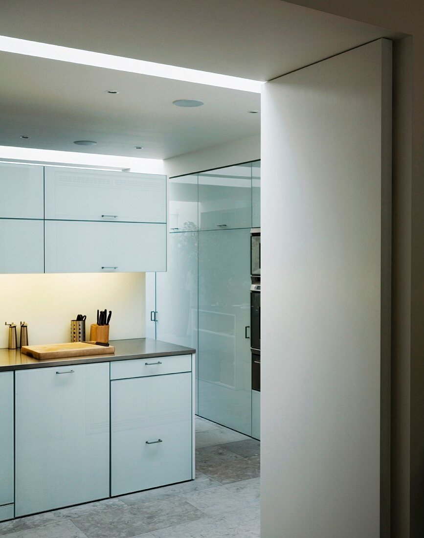Ample storage space in spacious kitchen with white cupboard doors