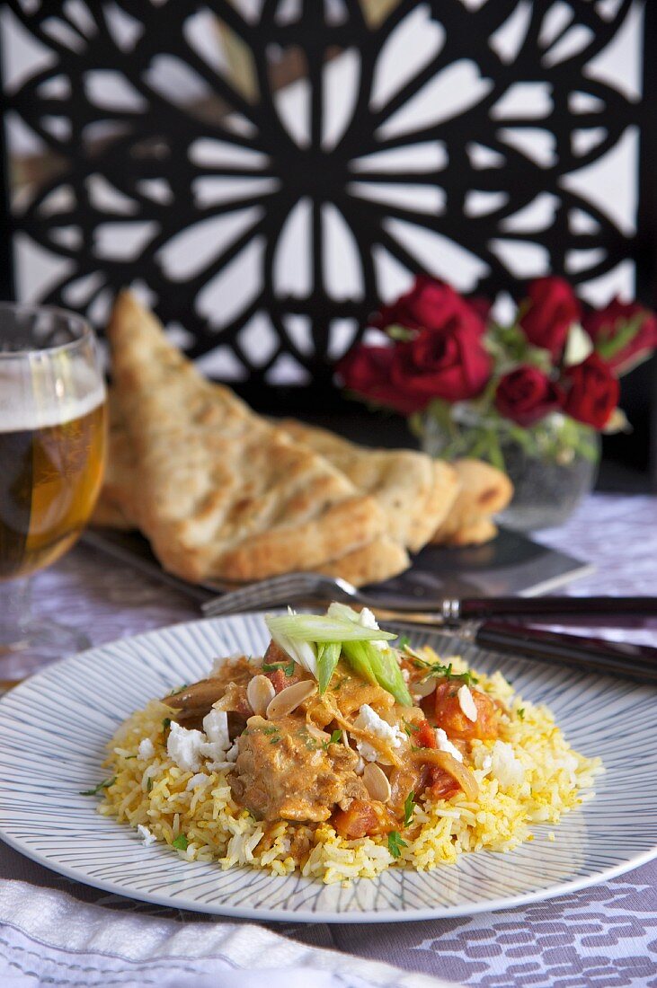 Chicken and tomato curry on a bed of rice