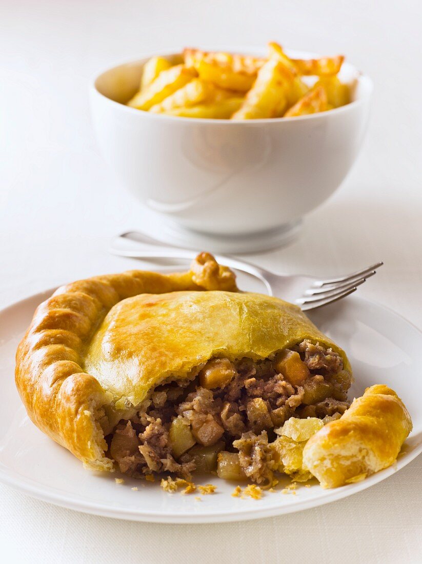 Beef pasty with french fries (England)