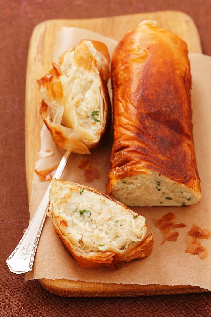 Puff pastry strudel with potato and fish pate