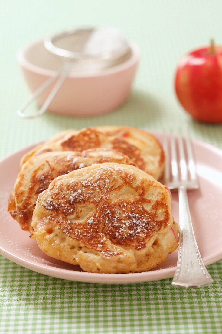 Apple pancakes with icing sugar