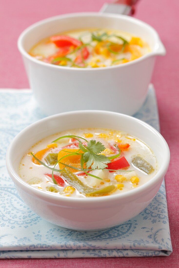 Sweet corn soup with peppers, potatoes and coriander