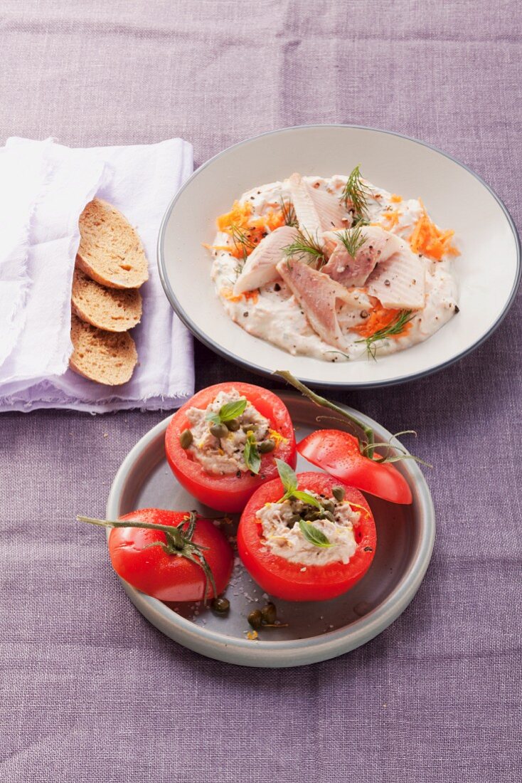 Smoked trout on horseradish quark and tomatoes stuffed with tuna fish and capers