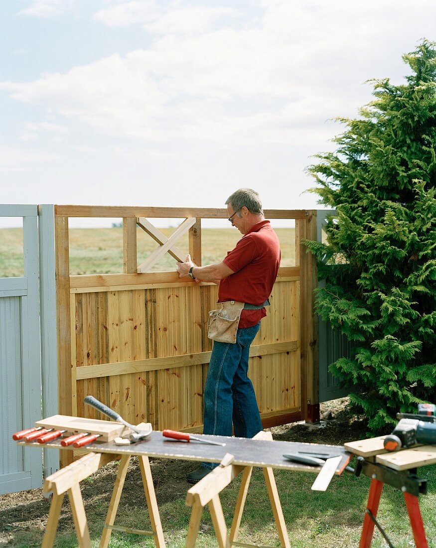 Man repairing a fence