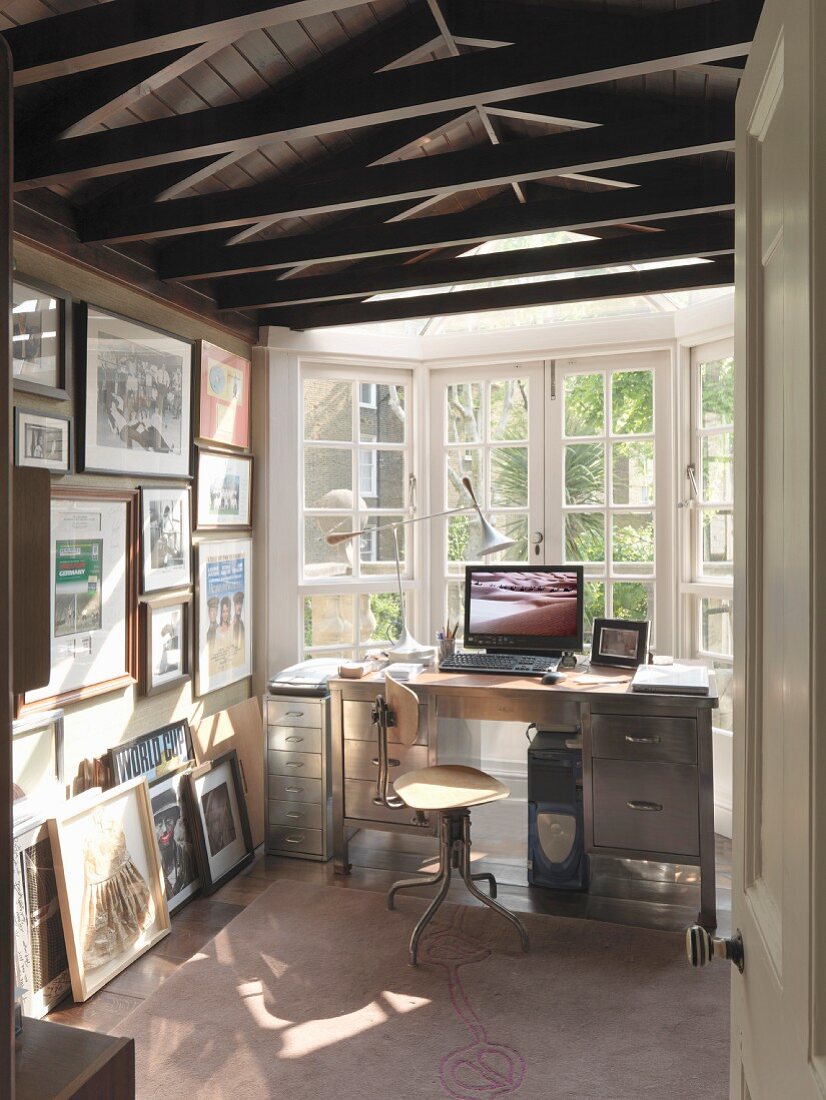 Narrow room with desk in bay window
