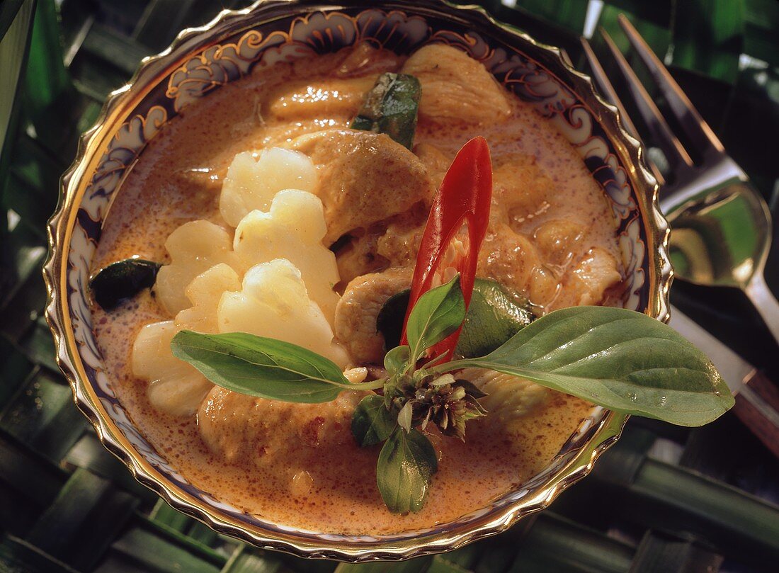 Chicken curry with pineapple in small bowl