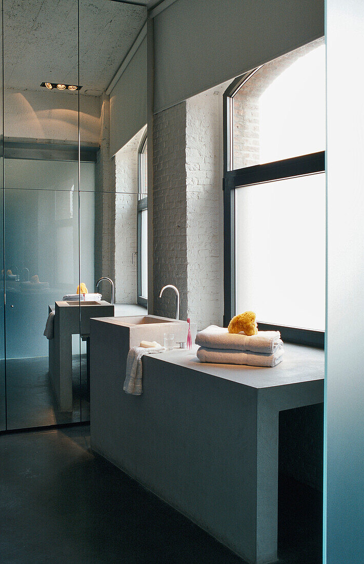 Modern bathroom with concrete washbasin