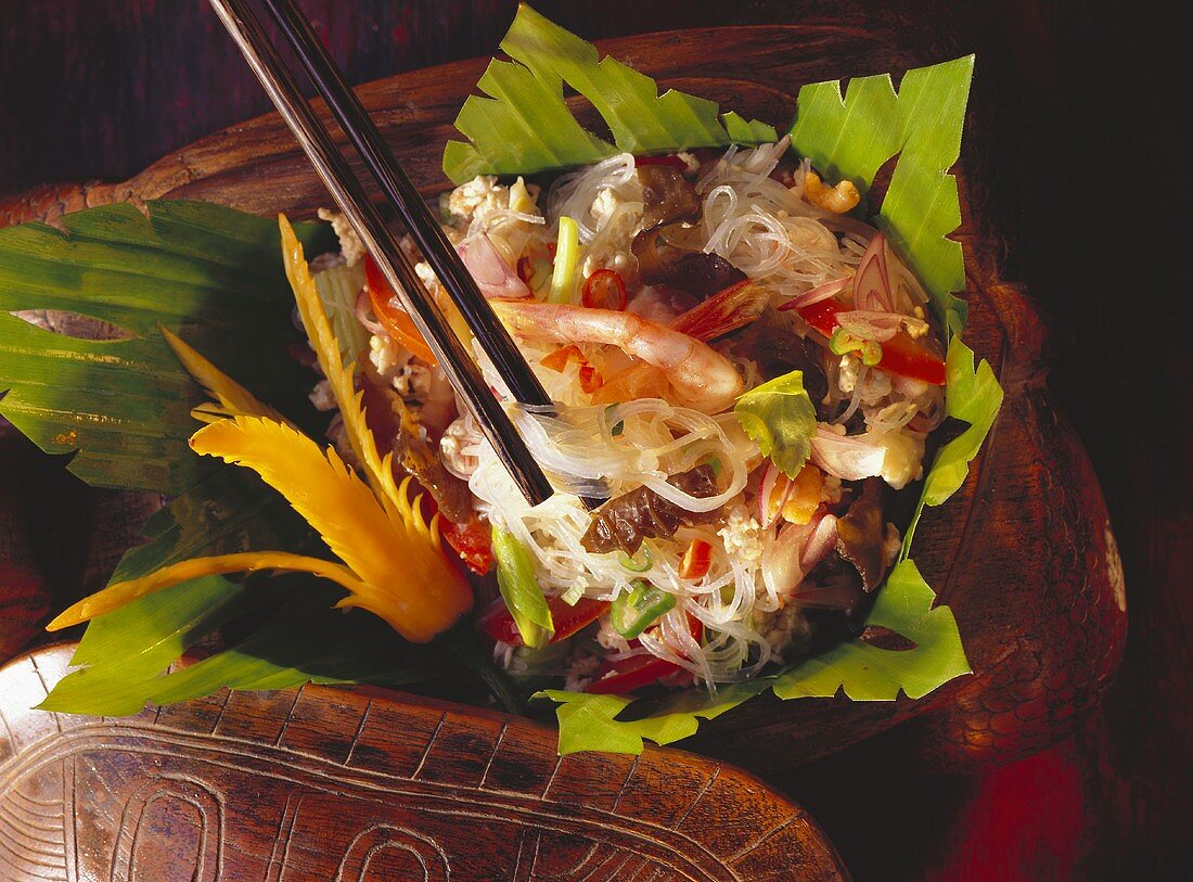 Shrimp Salad with Chinese Noodles on Leaves in a Bowl